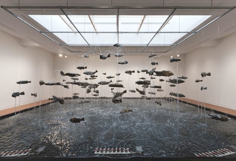 Bruce Nauman, One Hundred Fish Fountain, 2005 Ninety-seven bronze fish of seven different forms, suspended with stainless steel wire from a metal grid, Installation: 300 × 336 inches (762 × 853.4 cm)