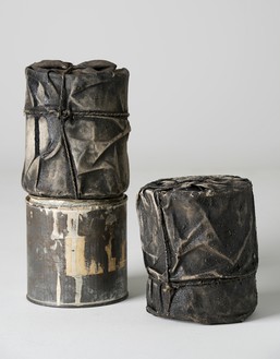 Christo, Wrapped Cans, 1958 Fabric, rope, lacquer, paint, sand, and cans, in 3 parts, each: 5 × 4 ⅛ × 4 ⅛ inches (12.5 × 10.5 × 10.5 cm)© Christo and Jeanne-Claude Foundation. Photo: Wolfgang Volz