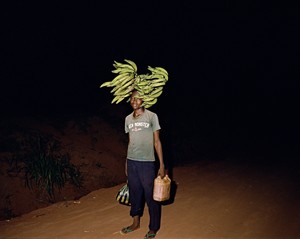 Deana Lawson, Walking Home on Some Road, Gemena, DR Congo, 2015. Pigment print, 35 × 44 inches (88.9 × 111.8 cm), edition of 3 + 2 AP © Deana Lawson