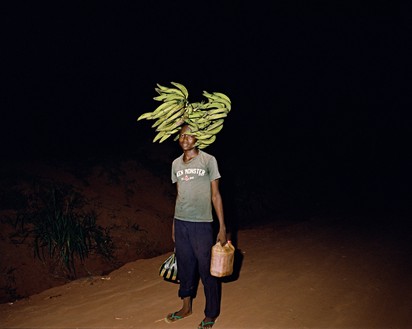 Deana Lawson, Walking Home on Some Road, Gemena, DR Congo, 2015 Pigment print, 35 × 44 inches (88.9 × 111.8 cm), edition of 3 + 2 AP© Deana Lawson