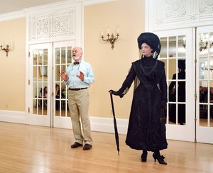 Jeff Wall, Ivan Sayers, costume historian, lectures at the University Women’s Club, Vancouver, 7 Dec. 2009. Virginia Newton-Moss wears a British ensemble c. 1910, from Sayers’ collection., 2009. Color photograph, 71 ⅞ × 88 ⅜ inches (182.5 × 224.3 cm) © Jeff Wall