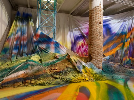 Katharina Grosse, Untitled Trumpet, 2015 Acrylic on wall, floor, and various objects, 21 feet 7 ¾ inches × 68 feet 10 ¾ inches × 42 feet 7 ⅞ inches (6.6 × 21 × 13 m), Biennale di Venezia, Venice, May 9–November 22, 2015© Katharina Grosse and VG Bild-Kunst, Bonn, Germany 2018. Photo: Nic Tenwiggenhorn