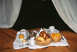 Nan Goldin, Breakfast in bed, Hotel Torre di Bellosguardo, Italy, 1996. Archival pigment print, 30 × 45 inches (76 × 114 cm), edition of 15 © Nan Goldin