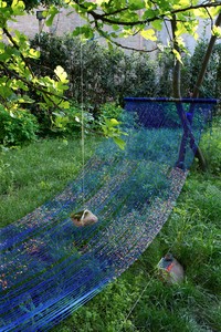 Sarah Sze, Landscape of Events Suspended Indefinitely (Hammock), 2015 (detail). Mixed media, including acrylic paint, string, cord, metal, stone, and archival photograph on Tyvek, 115 × 190 × 42 inches (292.1 × 482.6 × 106.7 cm) Installation view, Biennale di Venezia, 2015 © Sarah Sze