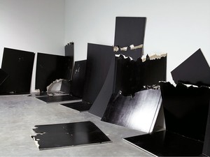 Steven Parrino, 13 Shattered Panels (for Joey Ramone), 2001. 13 standard panels of gypsum plaster board painted with black industrial lacquer, Dimensions variable