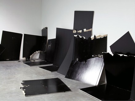 Steven Parrino, 13 Shattered Panels (for Joey Ramone), 2001 13 standard panels of gypsum plaster board painted with black industrial lacquer, Dimensions variable