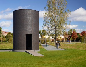 Theaster Gates, Black Vessel for a Saint, 2017. Brick, granite, Cor-Ten steel, concrete, and statue of St. Laurence covered with roofing membrane, 280 × 192 inches (711.2 × 487.7 cm), permanently installed in the Minneapolis Sculpture Garden © Theaster Gates Photo: Gene Pittman, courtesy Walker Art Center, Minneapolis