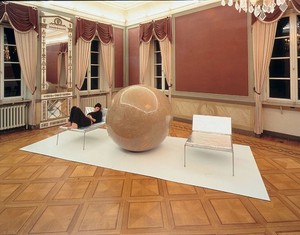 Franz West, Bryn, 2001. Circular brown sculpture and two silver divans, Dimensions variable