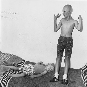 Roger Ballen, Children on Bed, 1996. Selenium toned gelatin silver print, 15 × 15 inches (38.1 × 38.1 cm), edition of 35