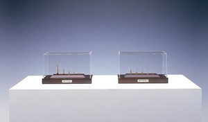 Chris Burden, Gold Bullets, 2003. 10 gold bullets in 2 wood and Plexiglas vitrines, each: 6 ¼ × 10 ¼ × 5 ¾ inches (15.9 × 26 × 14.6 cm), edition of 10 © Chris Burden/Licensed by The Chris Burden Estate and Artists Rights Society (ARS), New York. Photo: © Douglas M. Parker Studio