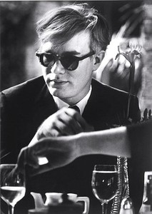 Dennis Hopper, Andy Warhol (at table), 1963. Gelatin silver print, 24 × 16 inches (61 × 40.6 cm)