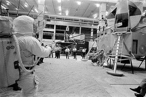 Neil Armstrong using the Lunar Equipment Conveyor (LEC) to send a mock-up of a rock box up to the cabin, April 5 or 18, 1969. Photo: courtesy NASA; scan: courtesy NASA Johnson
