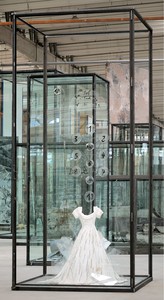 Anselm Kiefer, Die Schechina, 2010. Painted resin dress, glass shards, steel, numbered glass disks, and wire, in inscribed glass and steel vitrine, 179 ⅛ × 82 ¾ × 82 ¾ inches (455 × 210 × 210 cm) © Anselm Kiefer