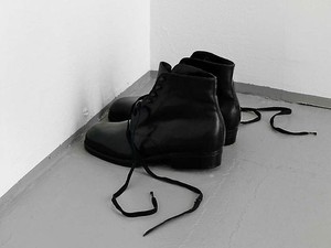 Tatiana Trouvé, Untitled (Men's shoes), 2009. Black patinated bronze, laces, 6 ⅛ × 4 × 11 ⅞ inches (15.6 × 10 × 30 cm)