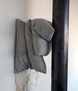 Tatiana Trouvé, Untitled (Cushion N°2), 2010. Concrete and metal column, Concrete element: 13 ¾ × 15 ¾ × 13 inches (35 × 40 × 33 cm), Metal Column: 118 × 4 ¾ × 4 ¾ inches (300 × 12 × 12 cm)