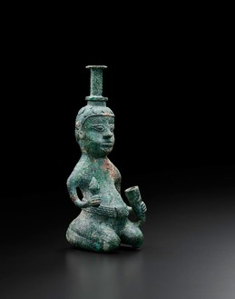 Small kneeling figure water container and dropper, Han dynasty (206 BCE–220 CE), Southwest China Bronze, height: 5 ½ inches (14 cm)Photo: Frédéric Dehaen, Studio Roger Asselberghs