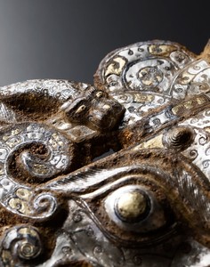 Masks and rings, early Western Han dynasty (206 BCE–9 CE) (detail). Iron inlaid with gold and silver, set of 2; each, height: 12 ¼ inches (31 cm) Photo: Frédéric Dehaen, Studio Roger Asselberghs
