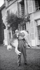 Picasso with Bob (the Great Pyrenees), Château de Boisgeloup, France, 1932. Modern print from original negative, 4 ⅝ × 2 ¾ inches (11.7 × 6.9 cm) Archives Olga Ruiz-Picasso © 2014 Estate of Pablo Picasso/Artists Rights Society (ARS), New York