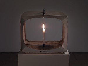 Nam June Paik, Candle TV, 1991–2003. Vintage metal television housing with permanent oil marker and lit candle, 15 × 16 ⅜ × 14 ⅞ inches (38.1 × 41.6 × 37.8 cm) © Nam June Paik Estate