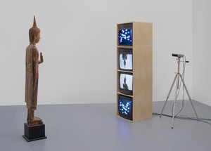 Nam June Paik, Standing Buddha with Outstretched Hand, 2005. Single-channel video (color, silent) with televisions, closed-circuit video (color), and wood Buddha with permanent oil marker, overall dimensions variable © Nam June Paik Estate