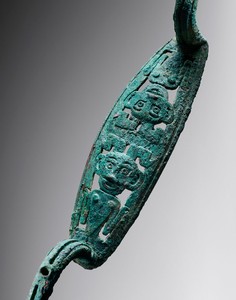 Bow-shaped fitting, Shang dynasty (1600–1050 BCE)—13th to 11th century BCE. Bronze, length: 14 ¼ inches (36 cm) Photo: Frédéric Dehaen, Studio Roger Asselberghs