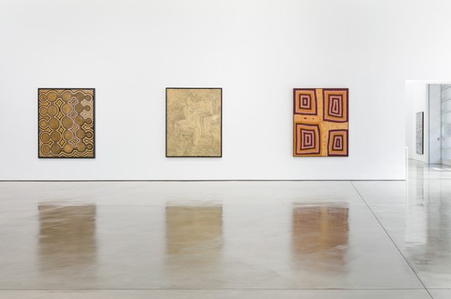 Installation view Artwork, left and right: © Ronnie Tjampitjinpa/Copyright Agency. Licensed by Artists Rights Society (ARS), New York, 2019; center: © Warlimpirrnga Tjapaltjarri/Copyright Agency. Licensed by Artists Rights Society (ARS), New York, 2019. Photo: Fredrik Nilsen