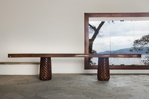 Original walnut and pine table conceived in 1941 by Curzio Malaparte in situ at Casa Malaparte, Capri. © Malaparte. Photo: Dariusz Jasak