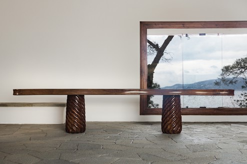 Original walnut and pine table conceived in 1941 by Curzio Malaparte in situ at Casa Malaparte, Capri © Malaparte. Photo: Dariusz Jasak