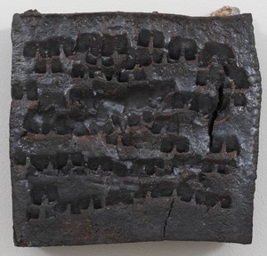 Theaster Gates, Brick Reliquary – Square with Marks, 2020. Wood-fired brick, wood ash, magnesium dioxide, and black stain, 12 × 12 × 4 inches (30.5 × 30.5 × 10.2 cm) © Theaster Gates. Photo: Rob McKeever