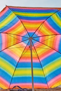 Roe Ethridge, Rainbow Beach Umbrella with Flip Flops, 2020. Dye sublimation print on aluminum, 60 × 40 inches (152.4 × 101.6 cm), edition 1/5 + 2 AP © Roe Ethridge