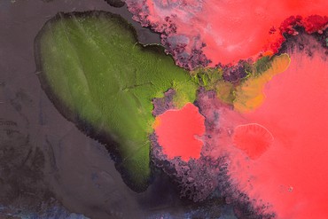 Abstract painting of purple, green, and pink made with oil paint and mixed media