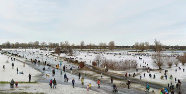 Many people outside in a winter landscape ice skating