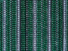 Several strings of clear and green beads hanging vertically