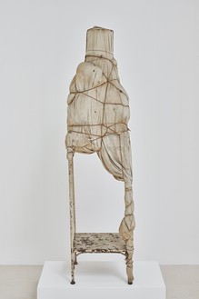 Christo, Package on a Table, 1961 Wood table, fabric (three types), twine, rope, lacquer, and a can, 59 ⅞ × 15 ⅜ × 15 ⅜ inches (152 × 39 × 39 cm)© Christo and Jeanne-Claude Foundation. Photo: Thomas Lannes