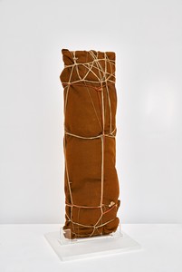 Christo, Package, 1961. Fabric, twine, rope, and wood board, 35 ⅞ × 11 ⅞ × 9 ½ inches (91 × 30 × 24 cm) © Christo and Jeanne-Claude Foundation. Photo: Thomas Lannes