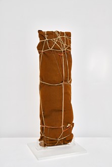 Christo, Package, 1961 Fabric, twine, rope, and wood board, 35 ⅞ × 11 ⅞ × 9 ½ inches (91 × 30 × 24 cm)© Christo and Jeanne-Claude Foundation. Photo: Thomas Lannes