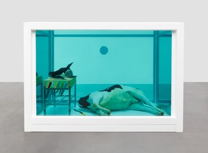 Damien Hirst, The Beheading of John the Baptist, 2006. Glass, painted stainless steel, silicone, ceramic floor tiles, stainless steel, resin butcher block, knives, machete, chainmail glove, cow, and formaldehyde solution, 90 ¾ × 131 ½ × 85 ⅜ inches (230.5 × 334 × 216.8 cm) © Damien Hirst and Science Ltd. All rights reserved, DACS 2022. Photo: Prudence Cuming Associates Ltd