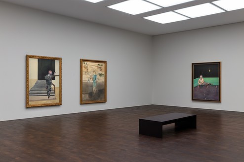 Installation view Artwork, left and right: © The Estate of Francis Bacon. All rights reserved, DACS 2022; center: © The Estate of Michael Andrews/Tate. Photo: Lucy Dawkins