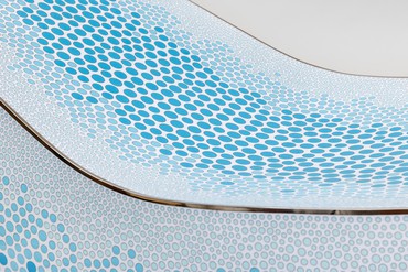 Detail of cloisonné work done in blue and white on a lounge chair by Marc Newson