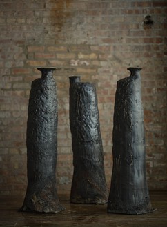 Theaster Gates, Untitled (King #1), Untitled (King #2), and Untitled (King #3), all 2022 Each: high-fired stoneware with glaze; #1 (left): 45 ⅛ × 13 ¾ × 15 ¼ inches (114.6 × 34.9 × 38.7 cm), #2 (center): 44 × 15 ⅛ × 13 inches (111.8 × 38.4 × 33 cm), #3 (right): 45 ⅛ × 15 ¼ × 16 inches (114.5 × 38.7 × 40.6 cm)© Theaster Gates. Photo: Chris Strong