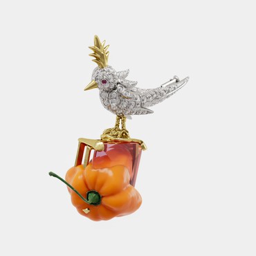 Digital sculpture of a pave-diamond bird joined to a orange pepper