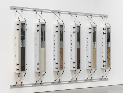 Ashley Bickerton, Minimalism’s Evil Orthodoxy/Monoculture’s Totalitarian Aesthetic, 1989/2023 Metal boxes, rocks, rice, peanuts, and water bags, overall: 96 × 155 ¾ × 12 ¼ inches (243.8 × 395.6 × 31.1 cm), 1 of 5 unique versions© Ashley Bickerton. Photo: Rob McKeever