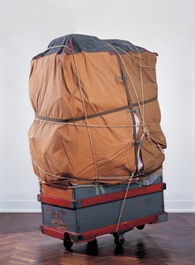 Christo, Dolly, 1964. Wood crate on casters, tarpaulin, polyethylene, fabric, ropes, and straps, 72 ⅛ × 40 × 32 ¼ inches (183 × 101.5 × 82 cm) © Christo and Jeanne-Claude Foundation