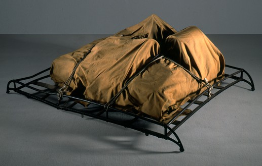 Christo, Package on a Luggage Rack, 1962 Tarpaulin, rubber-coated rope, and metal luggage rack, 24 ⅞ × 59 ⅛ × 42 ⅛ inches (63 × 150 × 107 cm)© Christo and Jeanne-Claude Foundation. Photo: Eeva-Inkeri