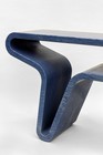Detail of a table by Marc Newson carved from a single piece of blue-gray Bardiglio marble