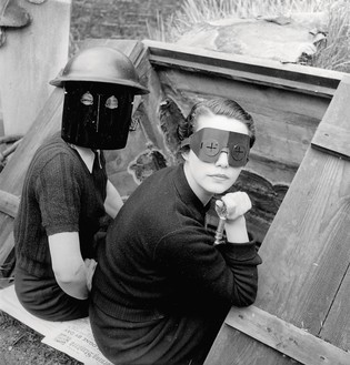 Lee Miller, Women with Fire Masks, London, England 1941, 1941 Gelatin silver print, 9 ½ × 9 inches (24.1 × 22.7 cm)© Lee Miller Archives, England 2023. All rights reserved. leemiller.co.uk