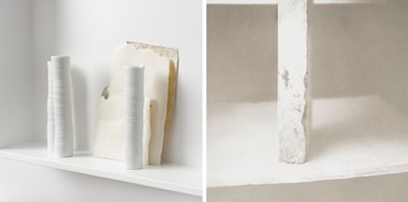 Composite image of shelf holding porcelain vessels an photograph of stone