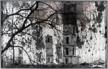 Steel-framed, black-and-white photograph of one of Anselm Kiefer’s series of monumental Die Himmelspaläste sculptures at La Ribaute, his former studio complex in Barjac, France
