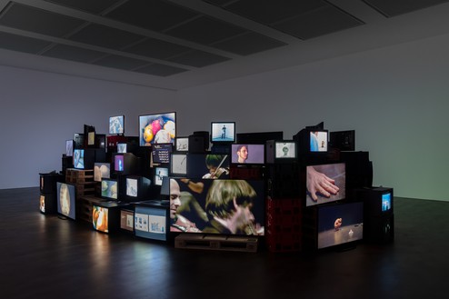 Installation view with Douglas Gordon, Pretty much every film and video work from about 1992 until now... (1999–) Artwork © Studio lost but found/VG Bild-Kunst, Bonn, Germany, 2024. Photo: Lucy Dawkins