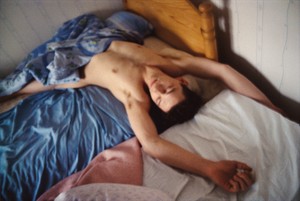 Nan Goldin Dieter on the bed, Stockholm (1984) from The Ballad of Sexual Dependency, 1973–86. 126 archival pigment prints, in frames, each: 15 ¾ × 11 × 1 ⅛ inches (40 × 27.9 × 2.9 cm), overall dimensions variable, edition of 10 © Nan Goldin